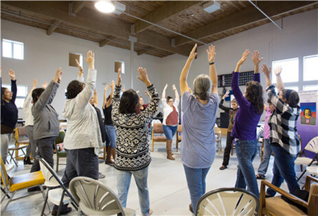 Circle of People Holding Hands Up High